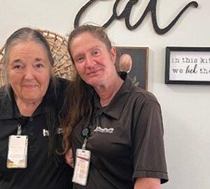 Kenwood Health and Rehabilitation Housekeeping Staff pictured, smiling for photo.