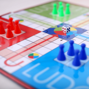 Colorful family board game, pieces and gameboard set for play
